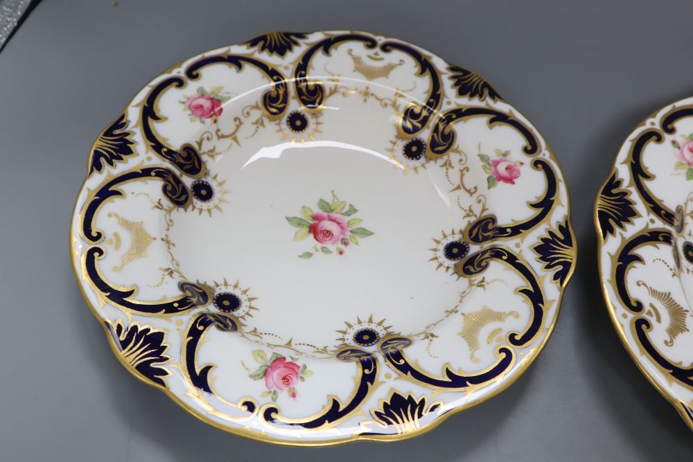 A pair of Coalport floral painted dessert plates, diameter 26cm